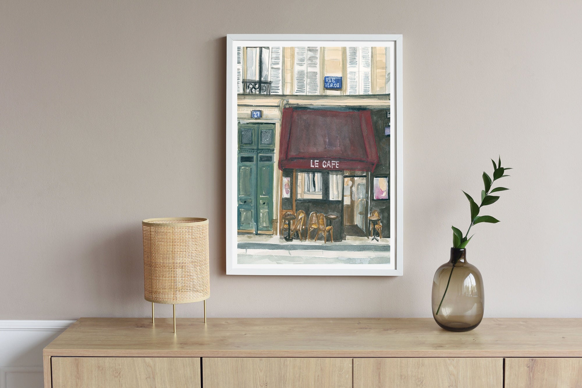 Paris cafe print of painting by Medjool Studio. Print of original gouache painting of the front of a small cafe in Paris, France featuring a burgundy awning, small tables and chairs out front.